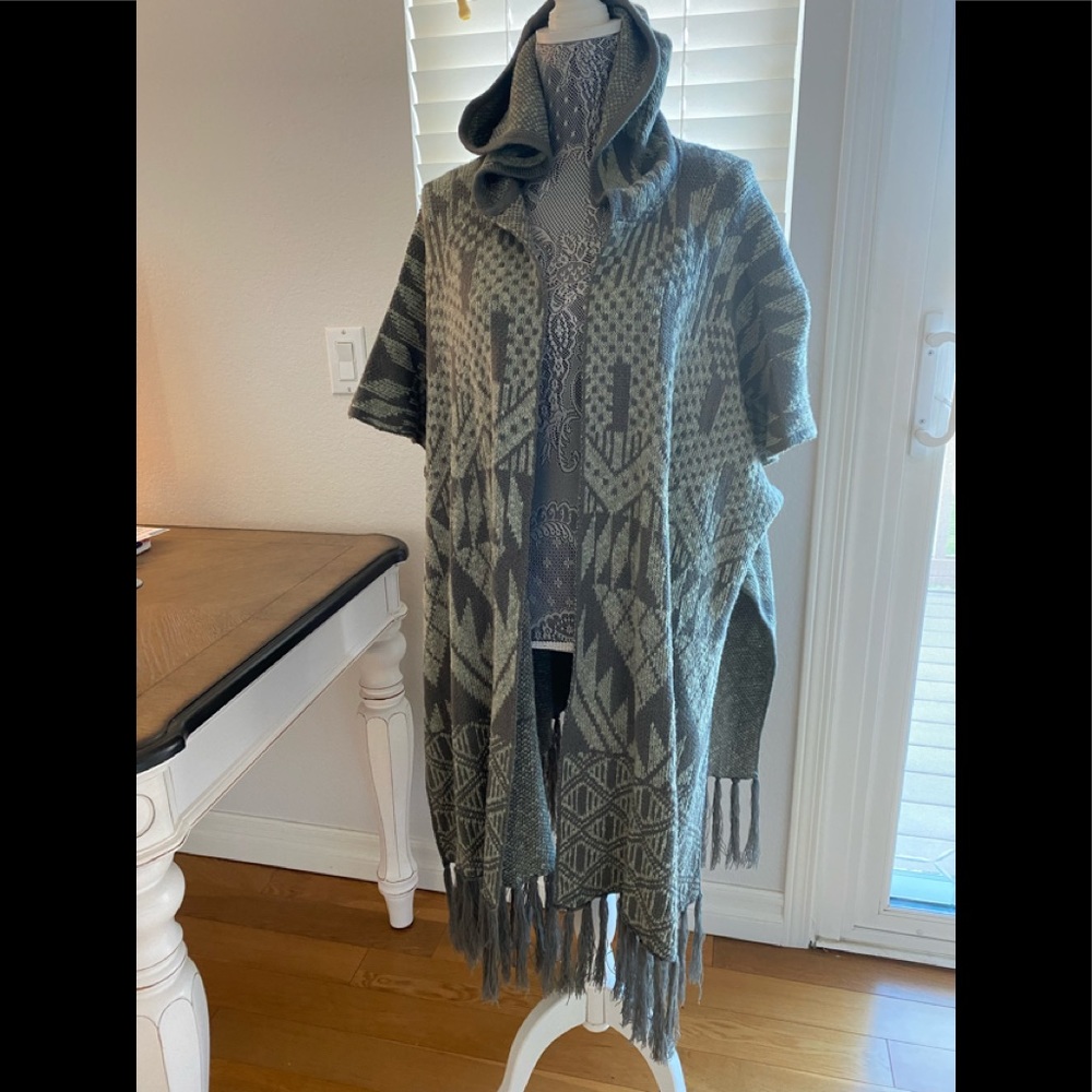 Rip Curl cardigan/poncho with fringe and hood.